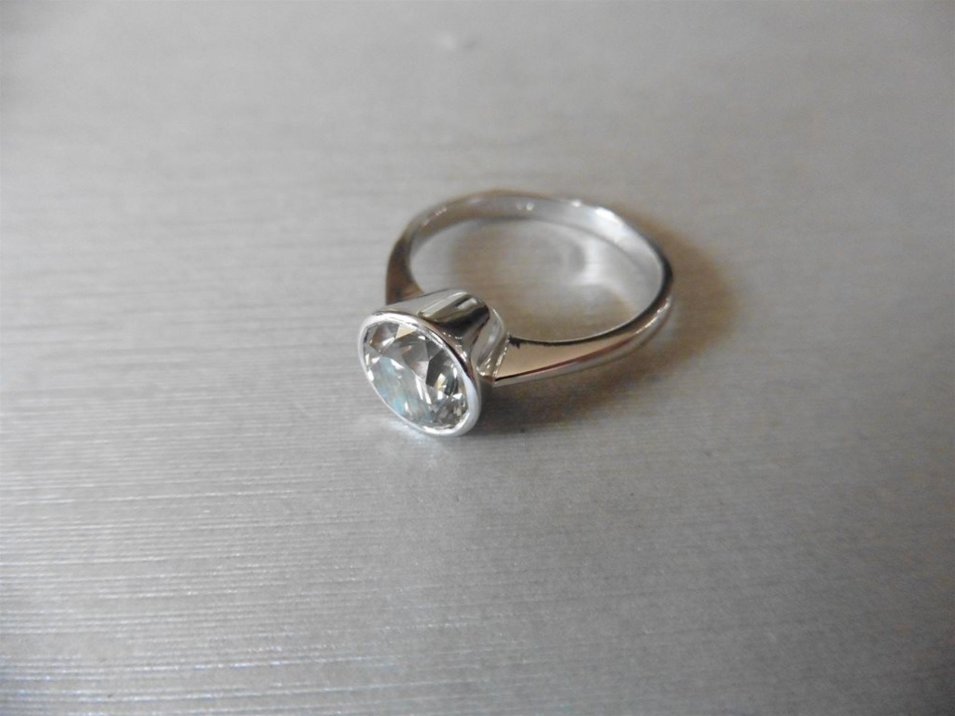 2.00ct diamond solitaire ring. Set in 18ct white gold rub over setting. L colour, Si2 clarity. Rin - Image 2 of 4