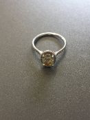 1.51ct diamond set solitaire ring set in platinum. Oval cut light yellow centre stone, VS1 clarity.