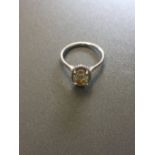 1.51ct diamond set solitaire ring set in platinum. Oval cut light yellow centre stone, VS1 clarity.