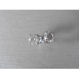 2.00ct Solitaire diamond stud earrings set with brilliant cut diamonds which have been enhanced. H/I