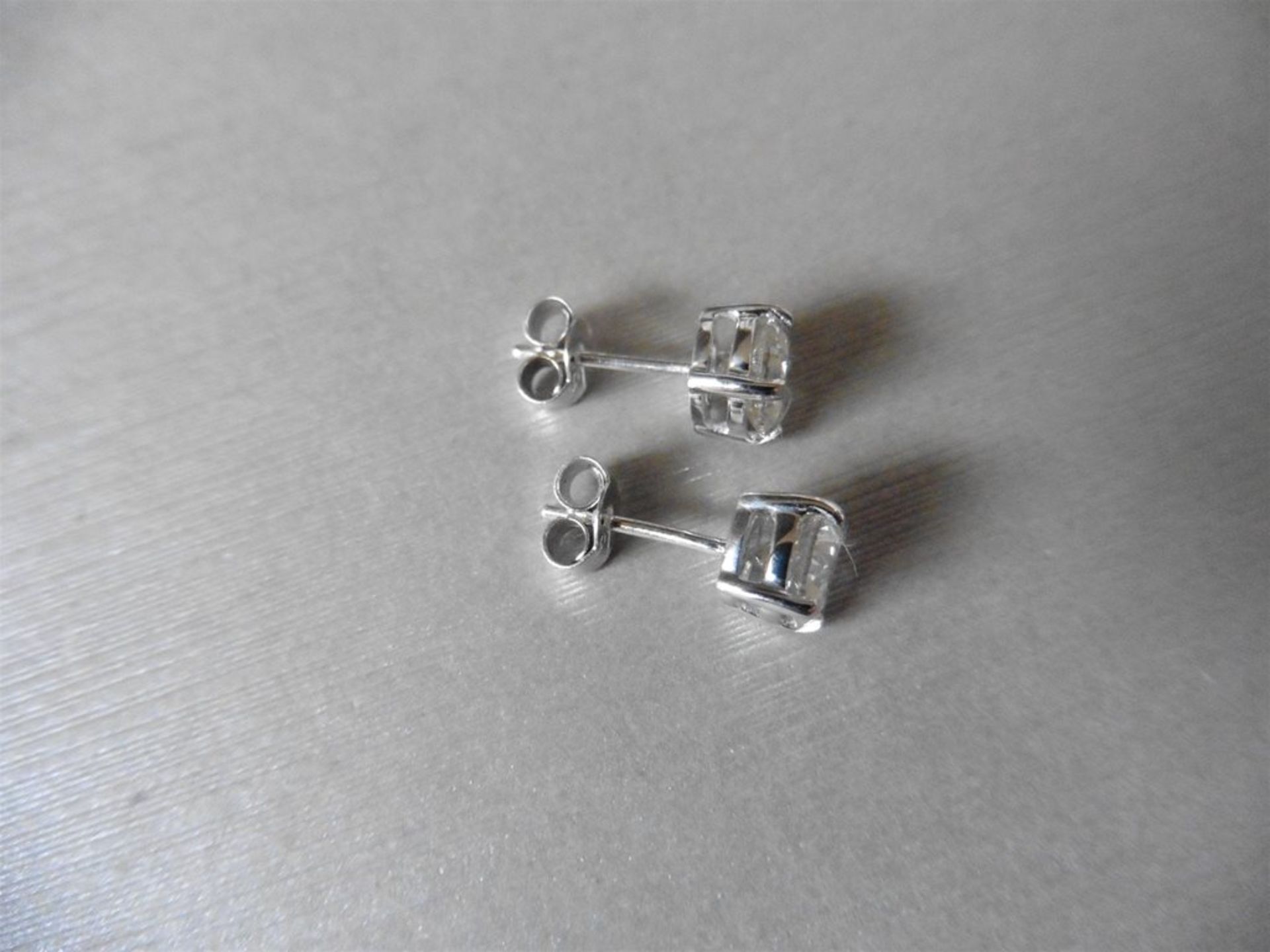 2.00ct Solitaire diamond stud earrings set with brilliant cut diamonds which have been enhanced. - Image 2 of 2