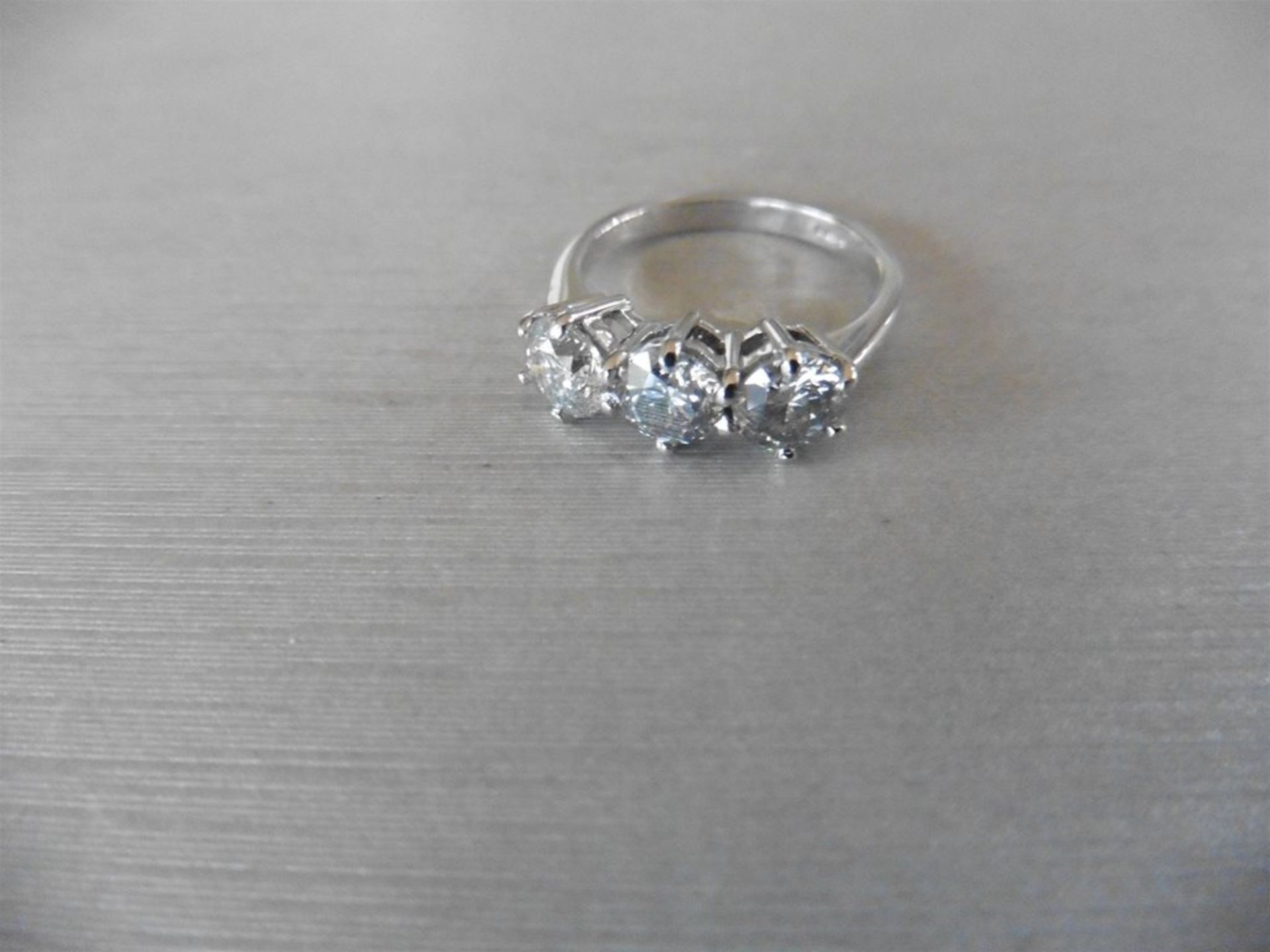 2.10ct trilogy diamond ring. 3 brilliant cut diamonds, I colour and I1 clarity. 6 claw setting in w