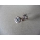 1.40ct Diamond set solitaire style earrings. Each set with 0.70ct brilliant cut diamond, I colour