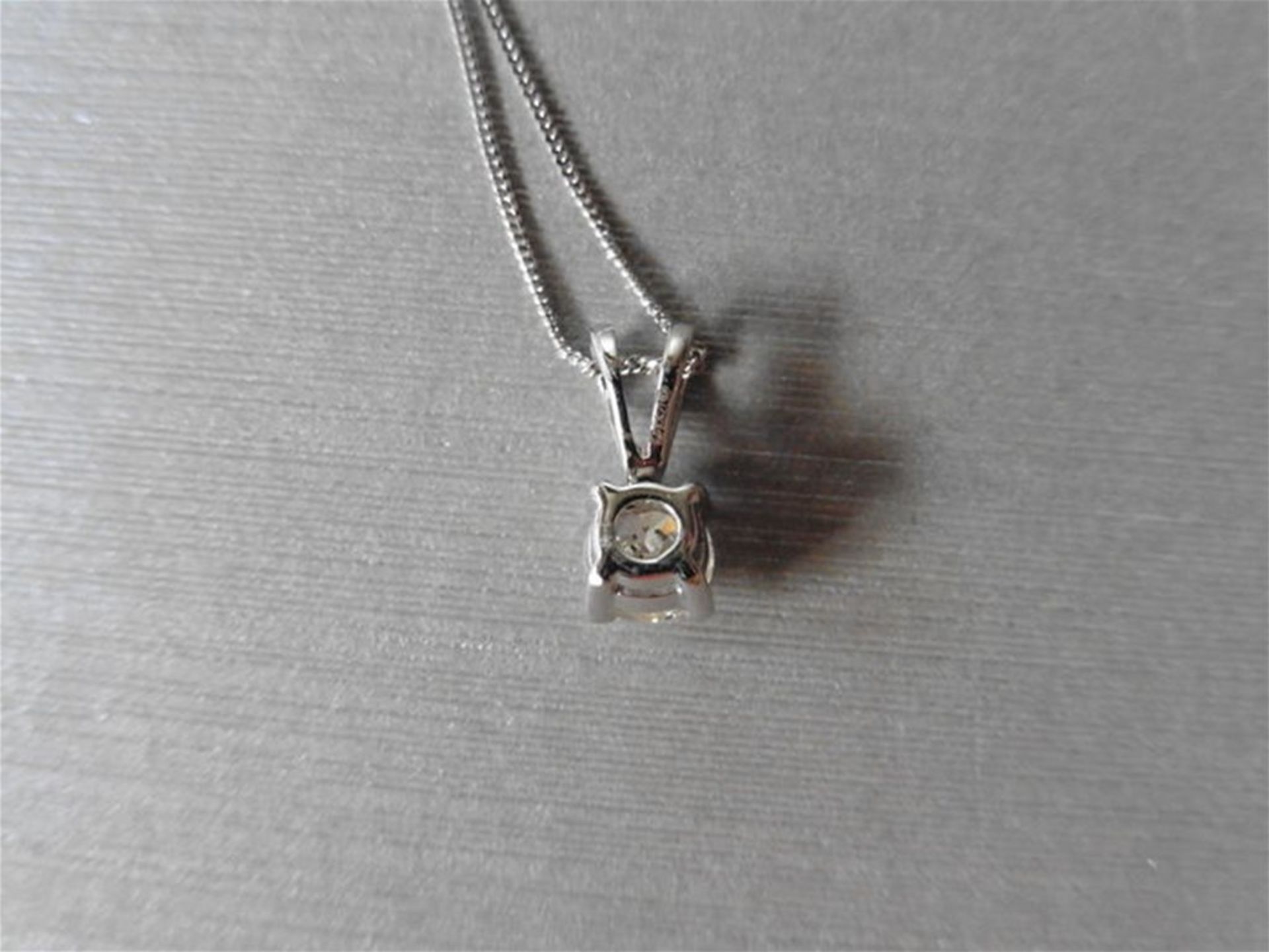 0.70ct diamond solitaire pendant. I colour, I1 clarity. Set in a platinum 4 claw mount with a split - Image 2 of 4