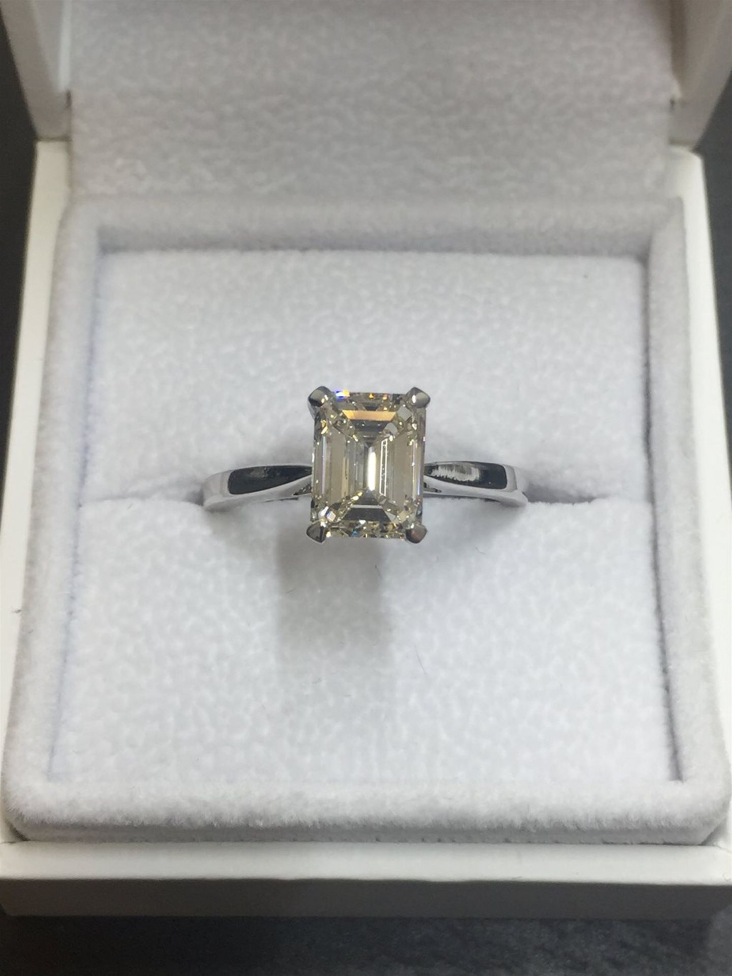 2ct diamond solitaire ring set with an emerald cut diamond, N ( light brown ) colour and VS1 clarity - Image 2 of 5