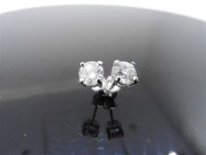2ct diamond solitaire earrings. Each with a 1ct enhanced brilliant cut diamond, G/H colour