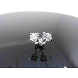 2ct diamond solitaire earrings. Each with a 1ct enhanced brilliant cut diamond, G/H colour