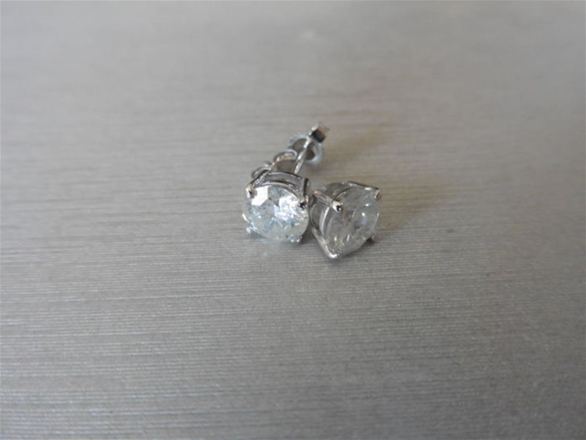 2.00ct Solitaire diamond stud earrings set with enhanced brilliant cut diamonds. G/H colour, i1 cla - Image 3 of 3