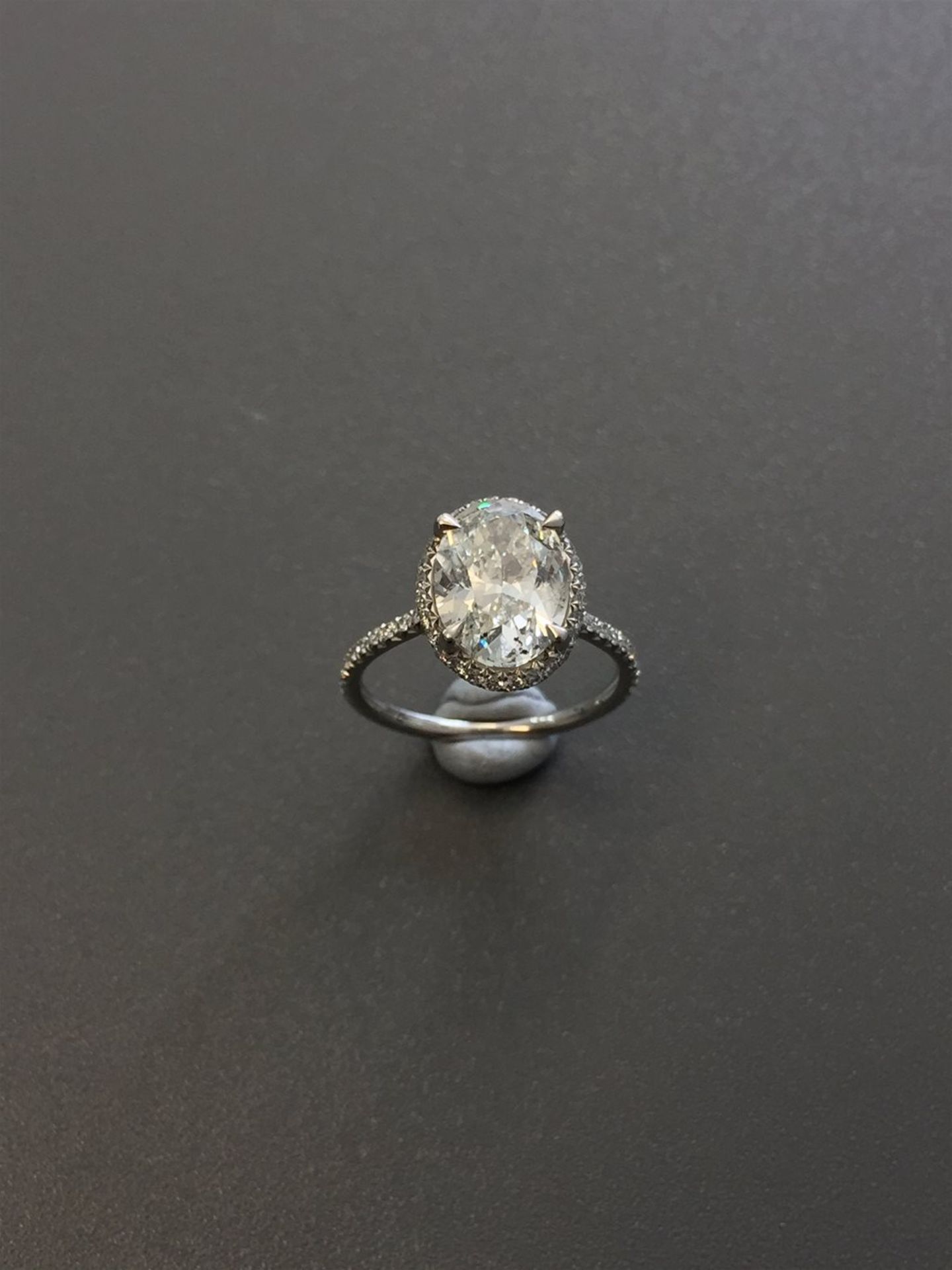 3.01ct diamond set solitaire ring. Oval cut diamond H colour si2 clarity in the centre with a halo - Image 2 of 6