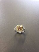 1.15ct diamond set solitaire ring with a yellow cushion cut yellow diamond and a halo setting and sp