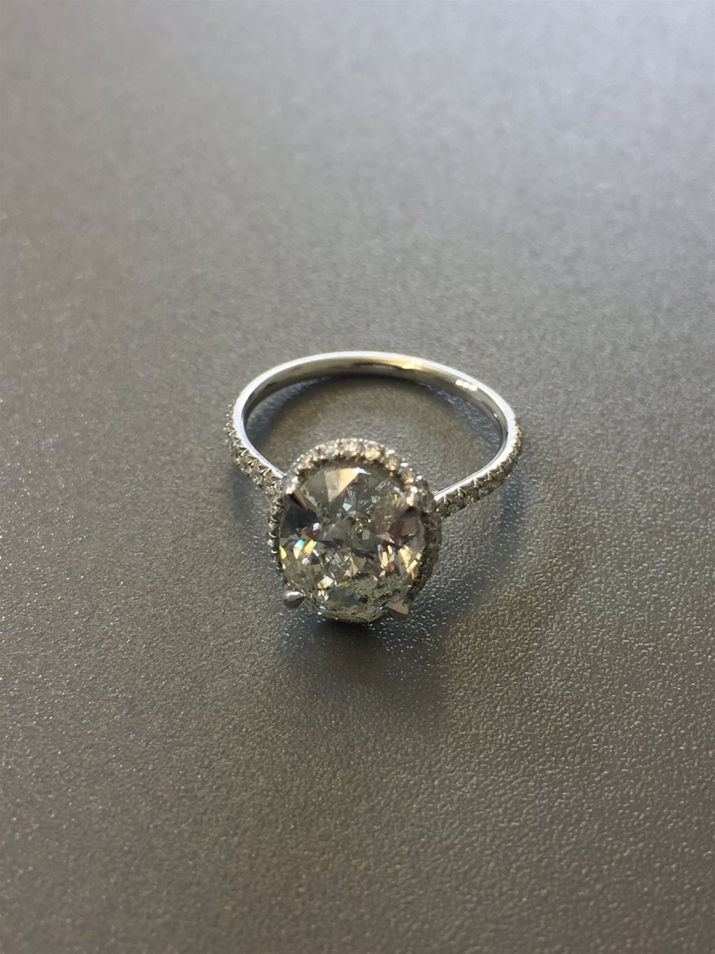 3.01ct diamond set solitaire ring. Oval cut diamond H colour si2 clarity in the centre with a halo - Image 3 of 6