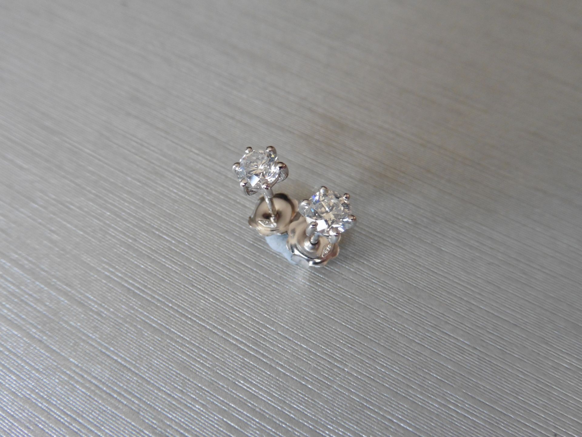 0.80ct Diamond solitaire earrings set with brilliant cut diamonds, I colour SI2 clarity. Six claw