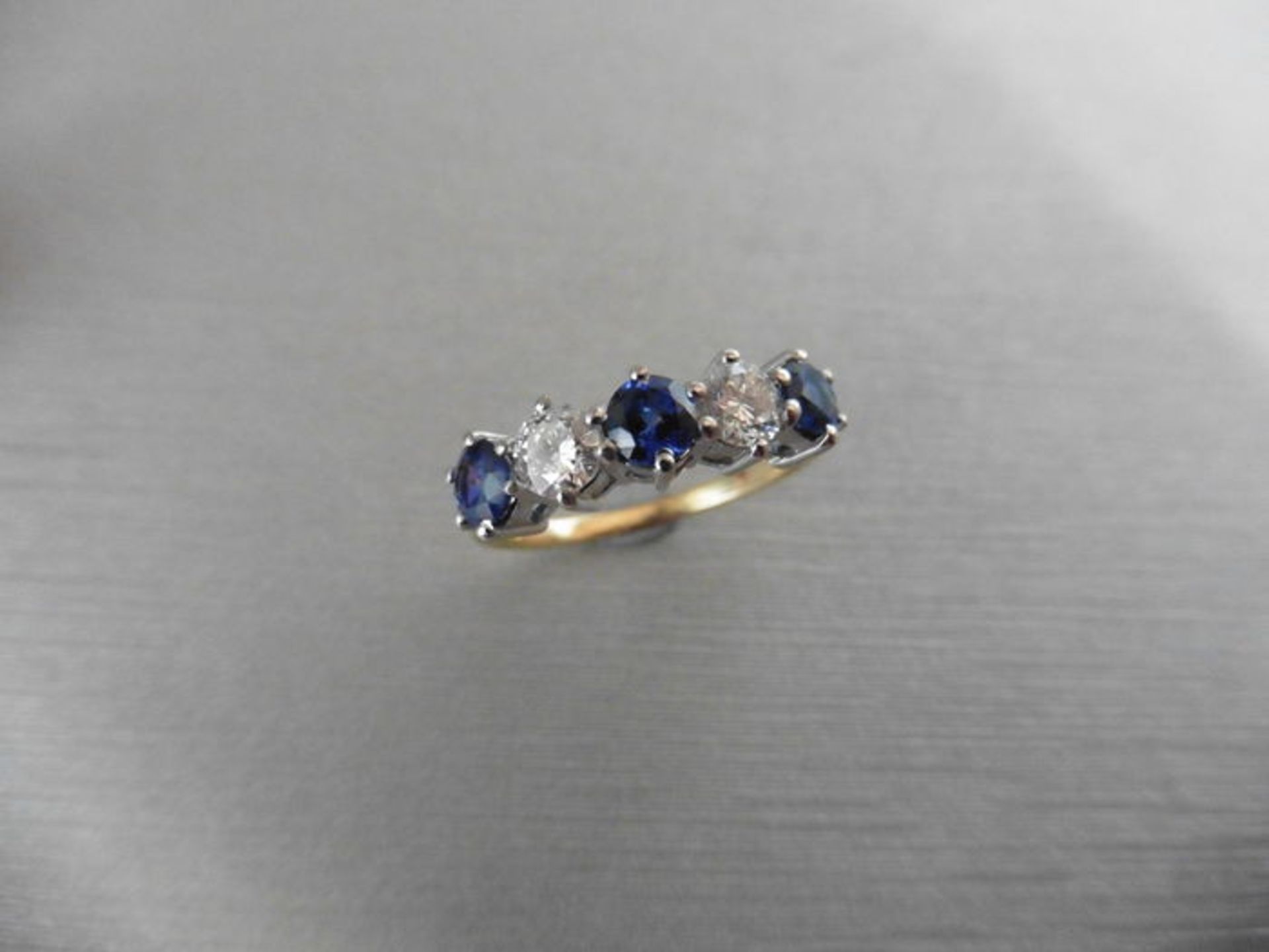 0.50ct sapphire and diamond five stone ring. 3 x round cut sapphires and 2 diamonds. I colour, si2