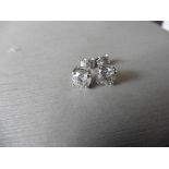 2.00ct Solitaire diamond stud earrings set with brilliant cut diamonds which have been enhanced. H/I