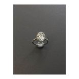 3.01ct diamond set solitaire ring. Oval cut diamond H colour si2 clarity in the centre with a halo