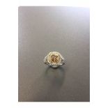 1.15ct diamond set solitaire ring with a yellow cushion cut yellow diamond and a halo setting and