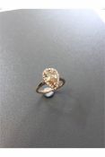 1.47ct pear shaped diamond set ring. Fancy yellow pear diamond, I1 clarity. Set in platinum. GIA