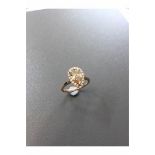 1.47ct pear shaped diamond set ring. Fancy yellow pear diamond, I1 clarity. Set in platinum. GIA