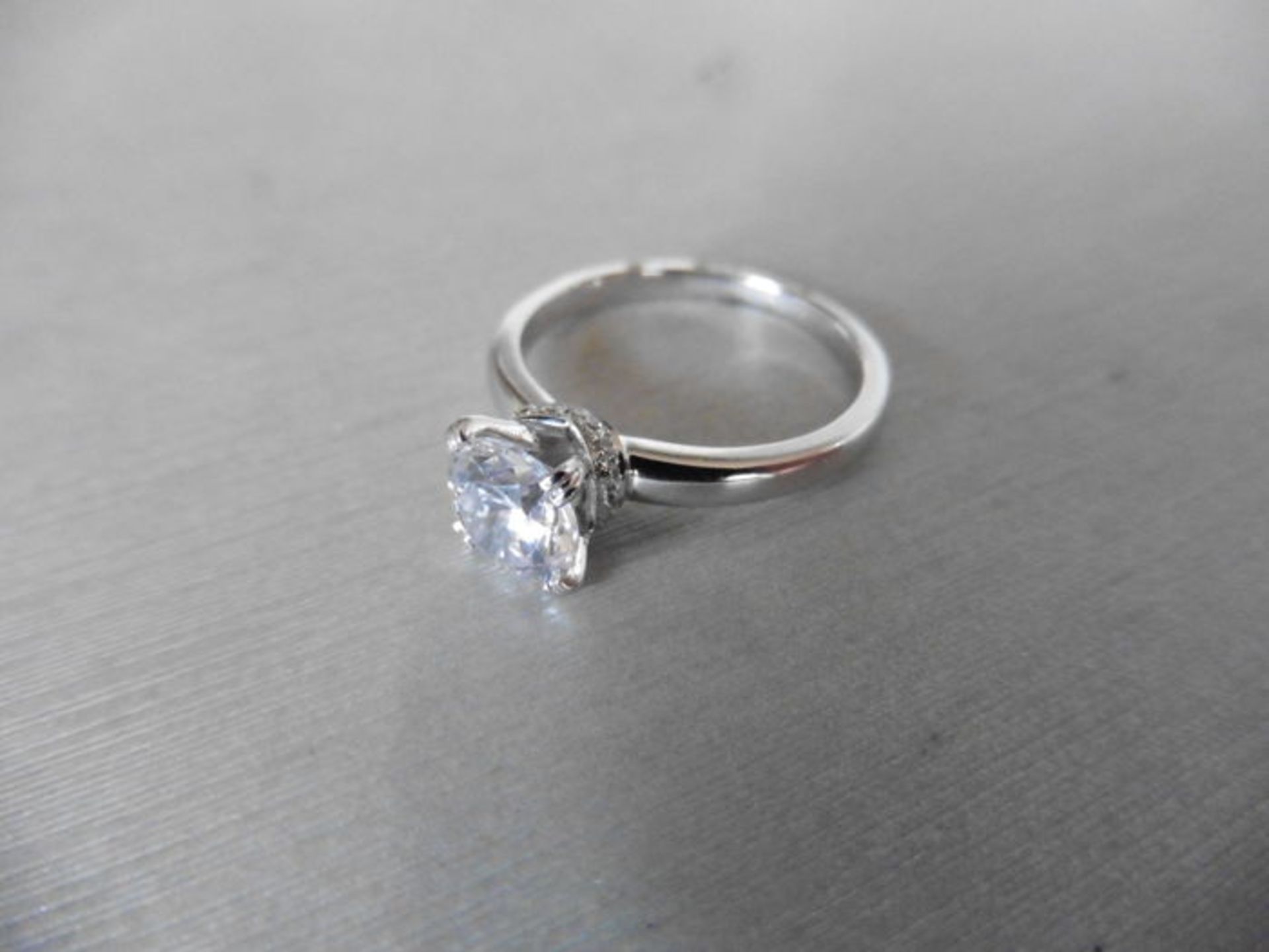 0.70ct diamond solitaire ring set in platinum. I colour, I1 clarity. 4 claw setting with diamond set - Image 3 of 4