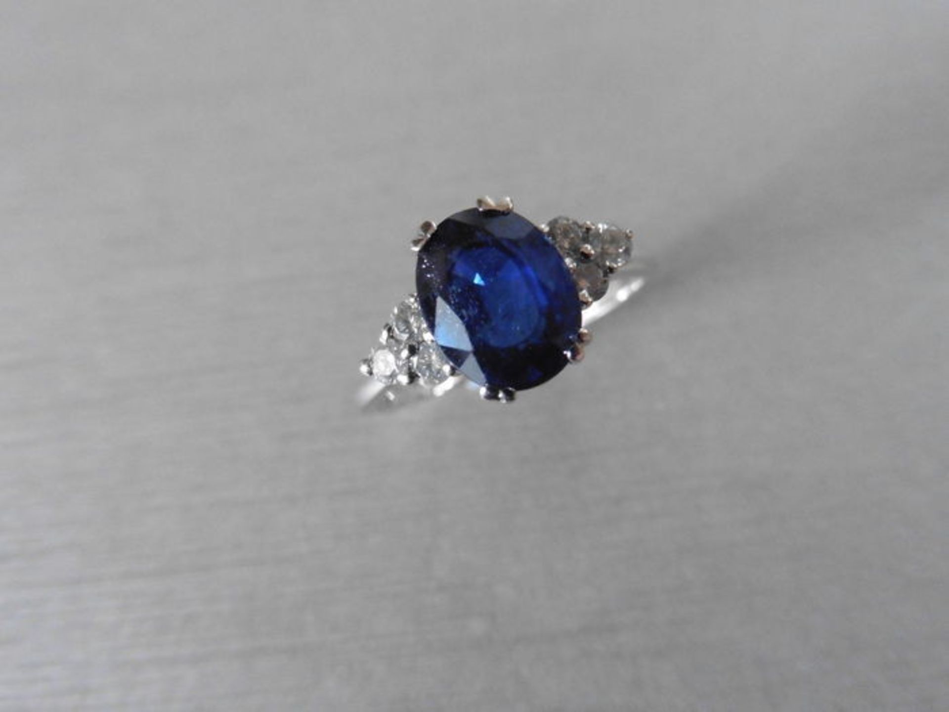 Sapphire and diamond dress ring set in platinum. Oval cut sapphire ( glass filled ) 2.40ct approx - Image 3 of 3