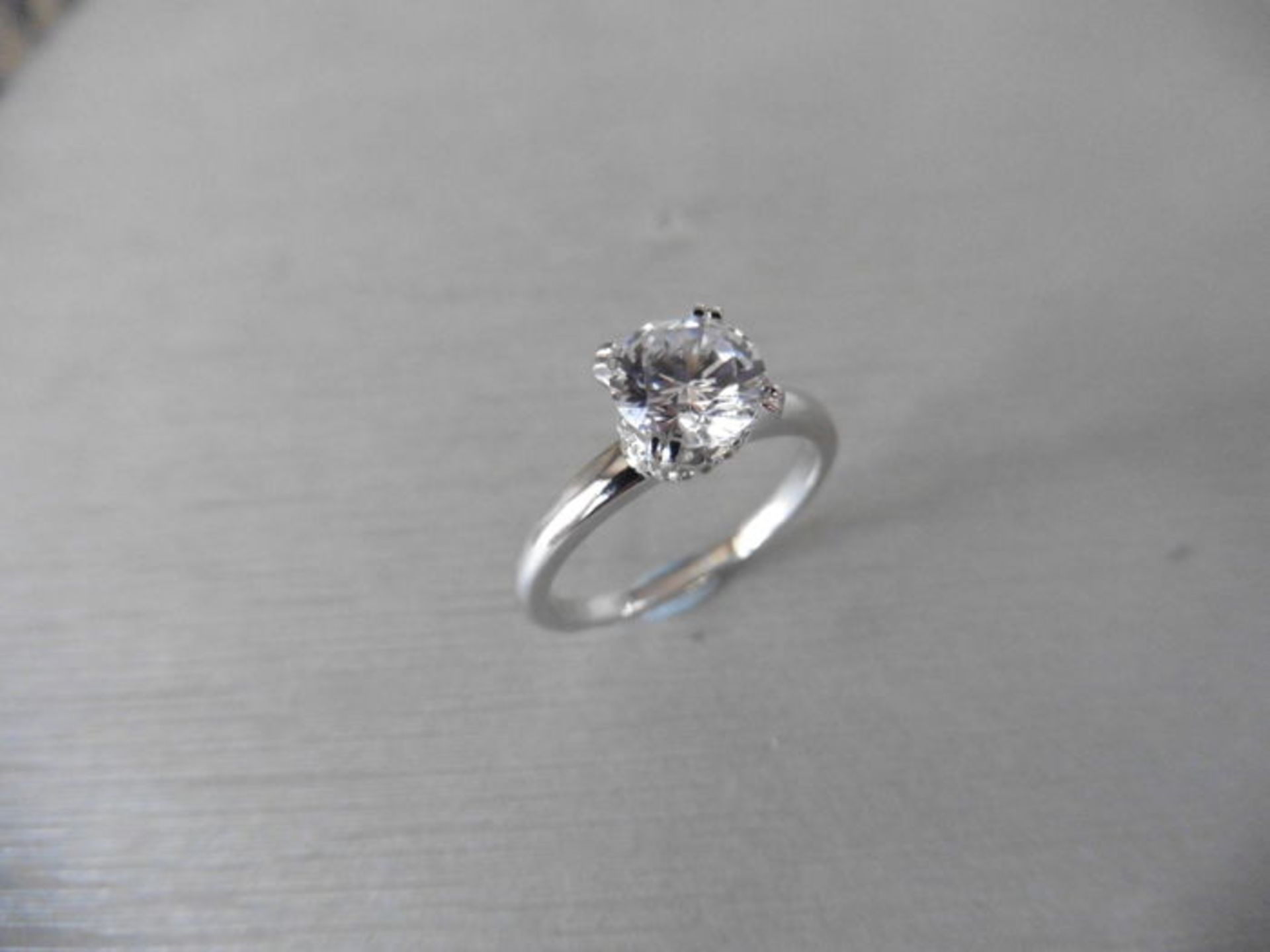0.70ct diamond solitaire ring set in platinum. I colour, I1 clarity. 4 claw setting with diamond set