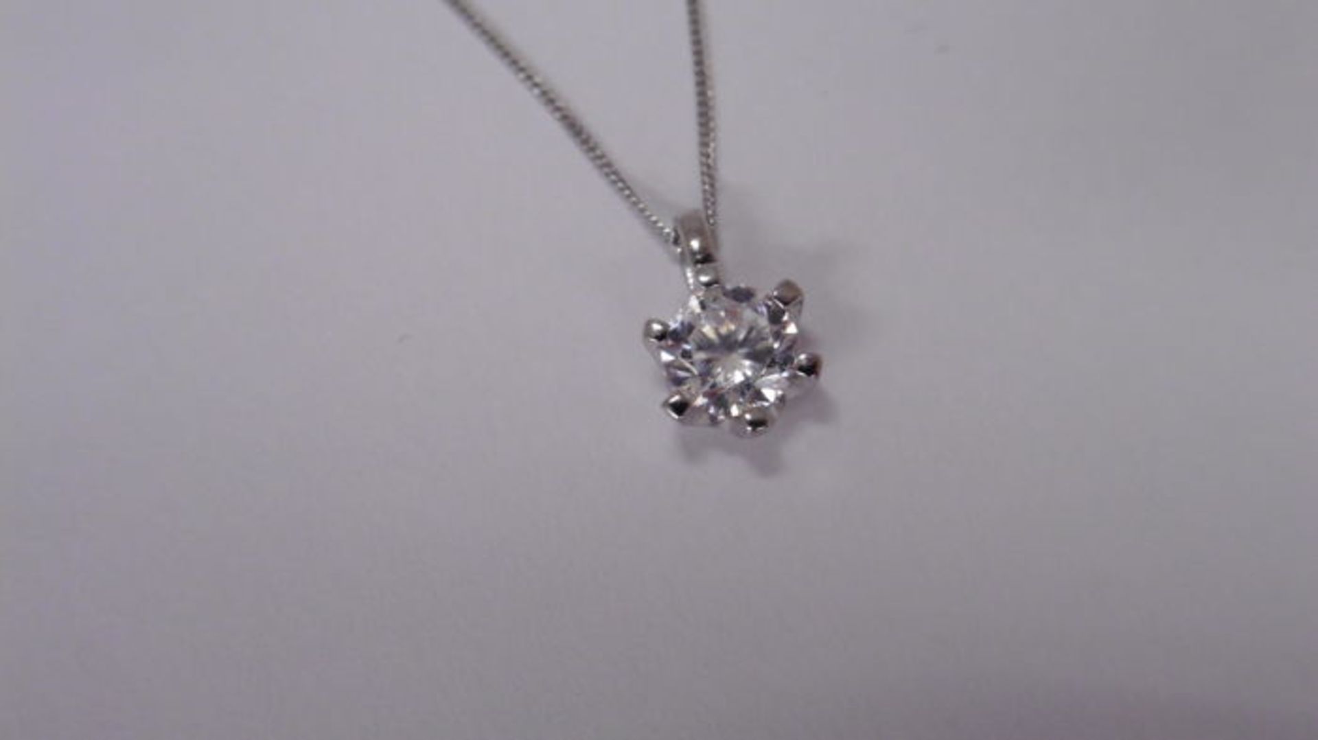 0.70ct diamond solitaire style pendant. Brilliant cut diamond, H/I colour and I1 clarity. Set in a 6