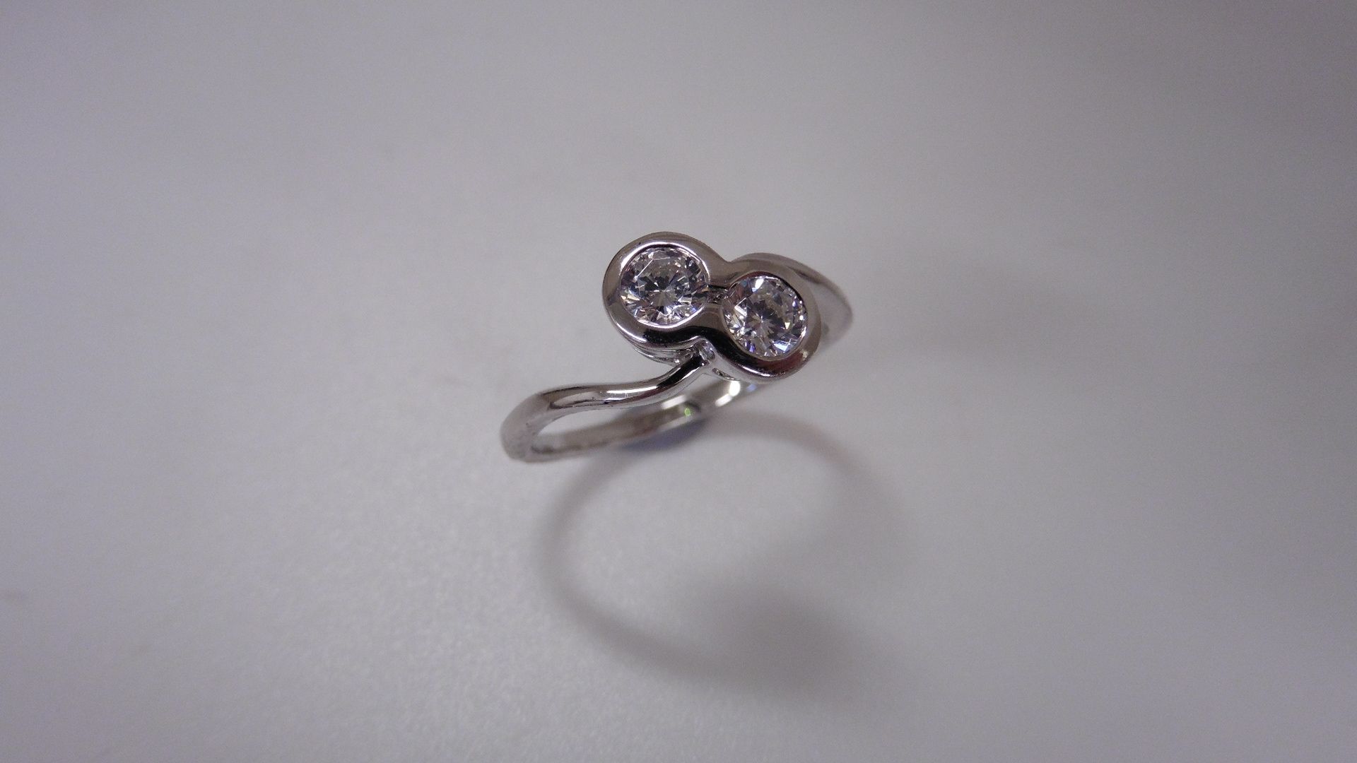 1ct two stone twist ring set in platinum. Brilliant cut diamonds, I/J colour, si2 clarity weighing