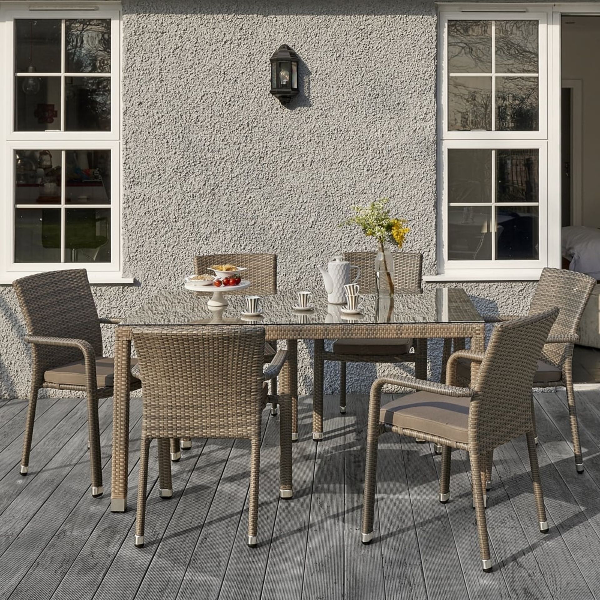 The Edinburgh rattan dining set in taupe.