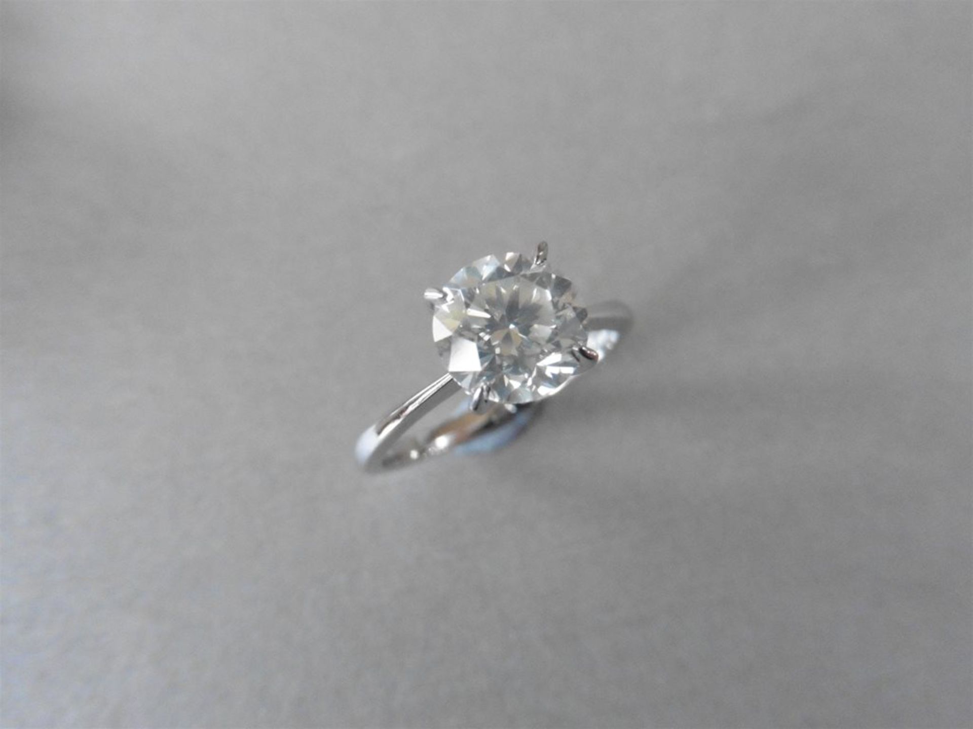 2.13ct diamond solitaire ring set with an enhanced brilliant cut diamond, H colour I2 clarity. 4 cla