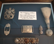 A Large Frame Of 'Volunteer Artillery' Badges And Insignia 1859-1908