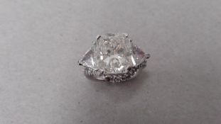 5.01ct radiant cut diamond ring. J colour, I1 clarity. 2 trillion cut diamonds set at the side