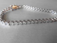 3.50ct tennis style bracelet set with brilliant cut diamonds. I colour, Si2 clarity. 18Ct white