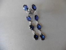 6ct sapphire and diamond drop earrings. Each set with 4 oval cut sapphires and 3 brilliant cut