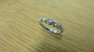 0.60ct diamond band ring with graduated brilliant cut diamonds, I colour, si2 clarity. Simple claw