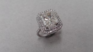 5.01ct radiant cut diamond set ring. Centre stone K colour and I 1clarity. Double halo of small