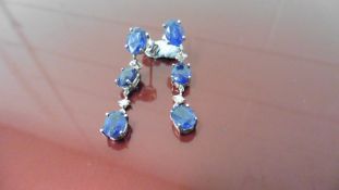 4.80ct sapphire and diamond drop earrings. Each set with3 oval cut sapphires ( glass filled ) and