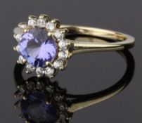 9CT GOLD CLUSTER RING, COMPRISING A RAISED BLUE STONE