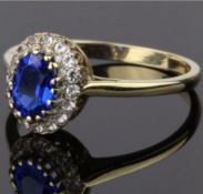 9CT GOLD HALO RING, COMPRISING A CENTRE OVAL SHAP