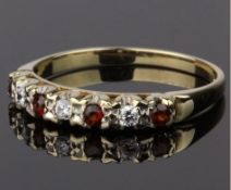 9CT GOLD GARNET AND CUBIC ZIRCONIA BAND RING