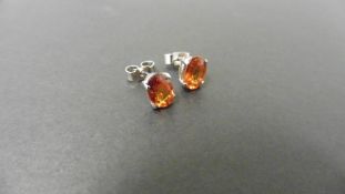 1.60ct citrine stud style earrings set in 9ct white gold. 7 x 5mm oval cut citrines set in a 4 claw.