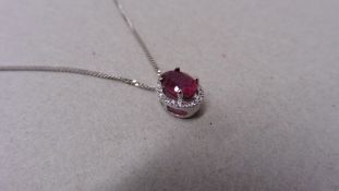 2.40ct halo set diamond pendant. Oval cut ruby ( glass filled ) in the centre, 2.40ct, with a halo