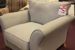 LARGE COMFY SOFA / LOUNGE CHAIR FINISHED IN A COOL LIGHT GREY FABRIC.