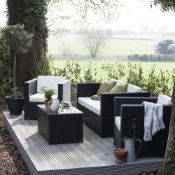 The Chelsea Black PU Rattanrattan garden sofa set consists of 2 armchairs with cushions, a 2