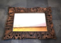 Artist: Malcolm Lewis - This is an elm swiss jigsaw mirror with copper stitching