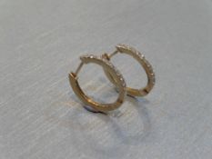 Hoop style diamond earrings. Each set with tiny brilliant cut diamonds, of H colour and Si