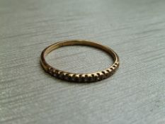 0.10ct diamond eternity style band ring set in 18ct gold wth small brilliant cut diamonds, H/I