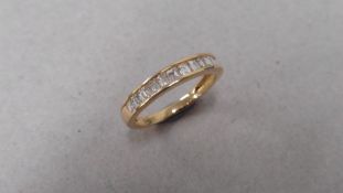 0.67ct diamond eternity style band. Emerald cut diamonds, H colour and si clarity. Channel setting