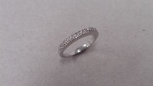18ct gold dimaond set band ring. Small brilliant cut diamonds H-J colour and si3-i1c clarity.