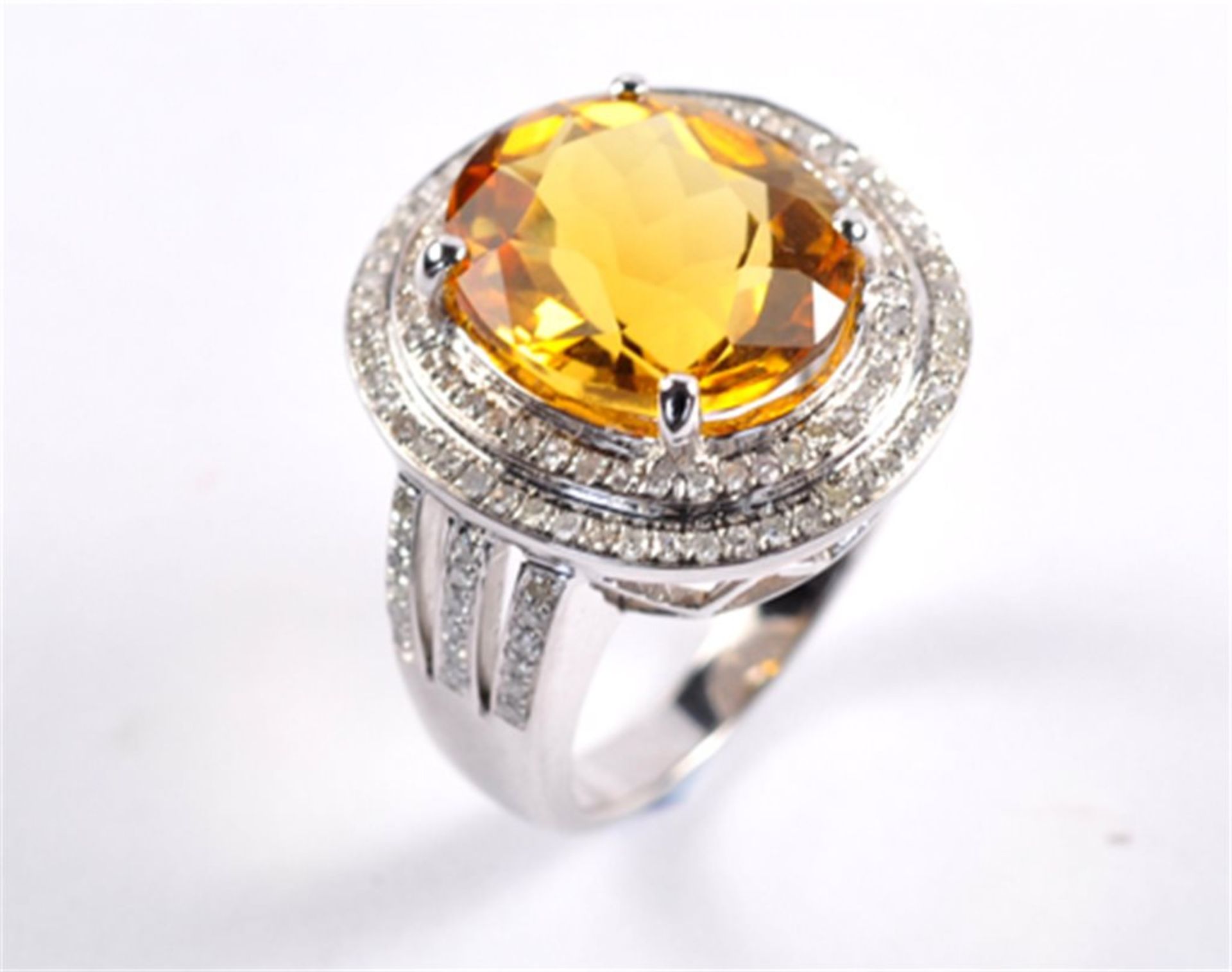 An Oval Citrine and Diamond Cocktail Ring