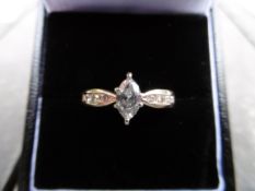 14ct Gold Marquise cut Diamond ring.0.48CT plus 4 small round cut Diamonds on each shoulder
